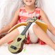 thumbnail image 4 of Instrumento musical pequeño para niños, imitación de ukelele, mini guitarra de juguete con cuatro cuerdas (39 cm, beige), 4 of 8
