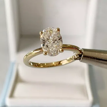 2Ct Oval Cut Lab Created White Diamond Women's Solitaire Engagement Ring in 14k Yellow Gold Plated