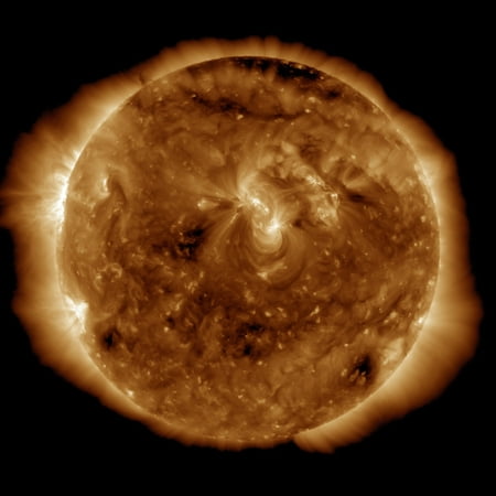 A dark rift in the suns atmosphere known as a coronal hole Rolled Canvas Art - Stocktrek Images (14 x