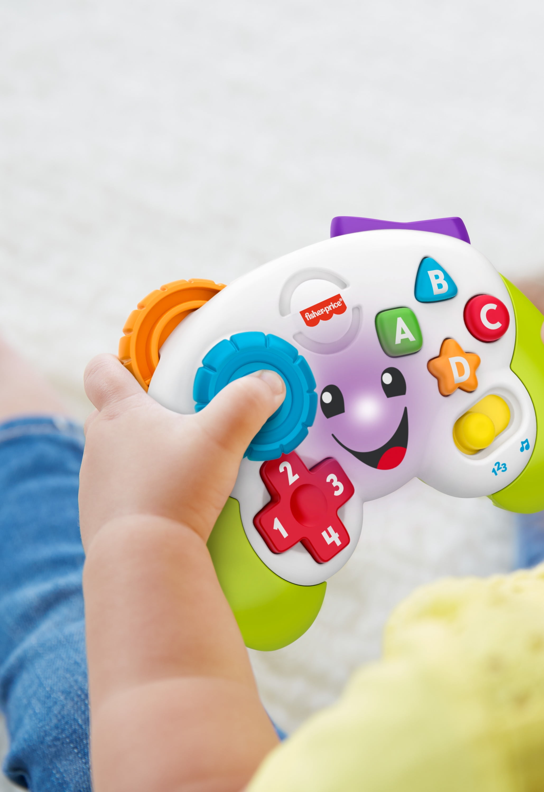 Fisher-Price Laugh & Learn Game & Learn Controller Musical Baby Toy with Lights, Multilanguage Version, Pretend video game controller learning toy for babies and toddlers with 2 musical play modes: Learning and Play