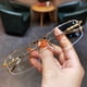 thumbnail image 1 of Gafas de miopía con montura de media montura que cambian de color y con alambre dorado para hombre y mujer, modernas, combinables con todo, con luz azul, 1 of 4