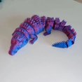 thumbnail image 1 of Muñeca biónica de cocodrilo impresa en 3D para decoración de escritorio de oficina en casa, color morado, 1 of 3
