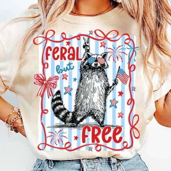 NETECOM Feral But Free Coquette Shirt - Funny Raccoon USA Tee - Trendy 4th of July Graphic - Stars and Stripes Aesthetic - Patriotic Red White and Blue Shirt – Classic Unisex Sizes S-5XL