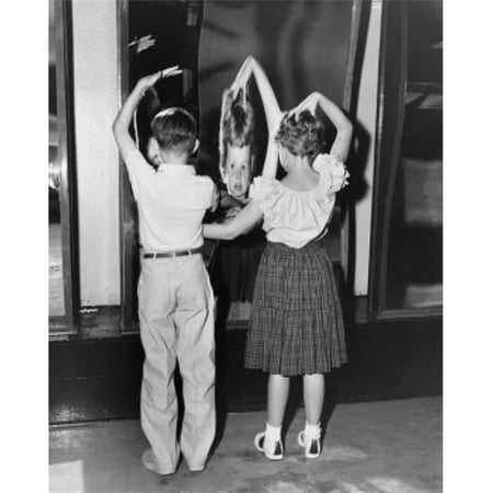 Posterazzi SAL255974 Rear View of Boy & Girl Looking in Fun Mirror Poster Print - 18 x 24 in.
