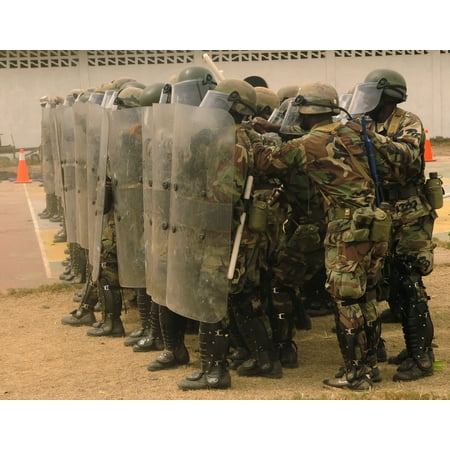 LAMINATED POSTER Armed forces of Liberia personnel participate in a non-lethal weapons skills demonstration at Edwin Poster Print 24 x
