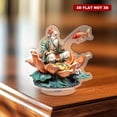 thumbnail image 6 of Rotating acrylic ornament featuring an old man in colorful attire fishing from a lotus with a jumping red carp against a white background, 6 of 8