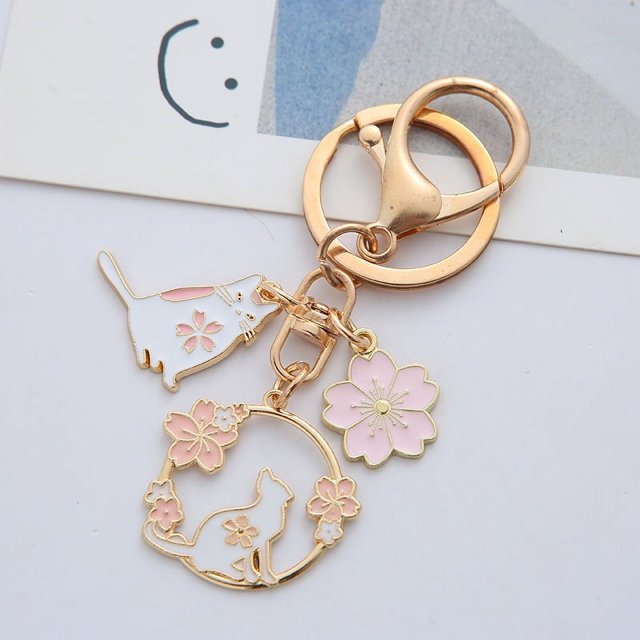 Llavero de conejo y gato, lindo llavero redondo de metal de conejo y gato, bonito llavero rosa Sakura bolsa de coche llavero para niña niño pareja joyería colgante (D), Como se muestra Zefei Wu 9024735055235