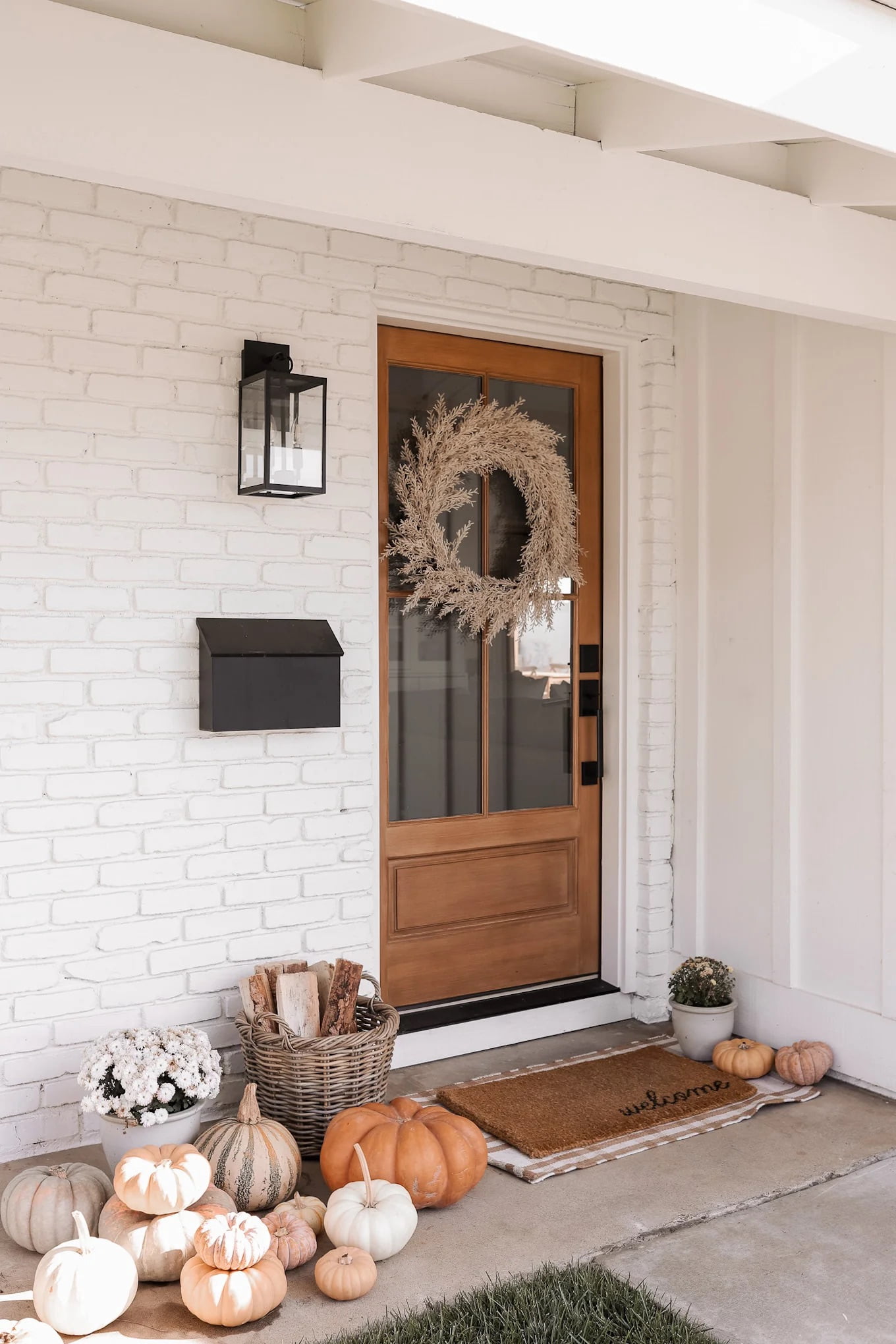 Nathan James Ferris Outdoor Black Wall Sconce Light Fixture with Iron Frame and Glass