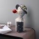 thumbnail image 4 of Figura de resina nórdica con burbujas de jabón, chica de pelo rizado con elegante sombrero de copa. gris, 4 of 8