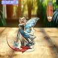 thumbnail image 1 of Présentoir Acrylique Rotatif avec une Fée aux Ailes Bleues et Robe de style Peint Hyper-Réaliste sur Fond Blanc, 1 of 6