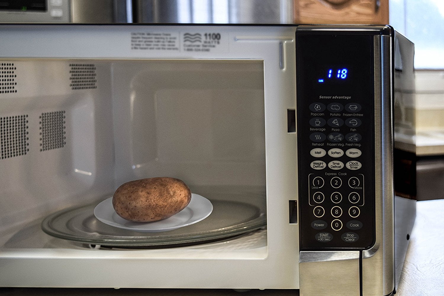 Oster OGYZ1604VS 1.6 Cubic Foot 1100 Watt Microwave Oven with Inverter and Senso