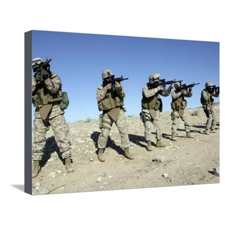 Military Transistion Team Members Quickly Reload Their Rifles Stretched Canvas Print Wall Art By Stocktrek