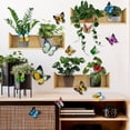 thumbnail image 1 of ¡Ahorra Más!, Pegatinas de pared con plantas en macetas verdes y 12 mariposas de colores como pegatinas decorativas Akmoler, 1 of 5