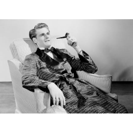 Man smoking pipe in armchair Canvas Art - (24 x 36)