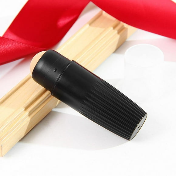 Rodillo facial absorbente de aceite reutilizable Macarena Mini Rodillo de piedra ánica Negro