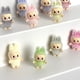 thumbnail image 3 of 10 Uds Mini muñeca Labubu flocado vinilo bebé Kawaii colgante accesorios adornos decoración de escritorio recoger juguete regalo para niños, 3 of 5