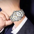 thumbnail image 2 of Reloj luminoso SKMEI para hombre con correa plateada y dorada y esfera plateada., 2 of 5