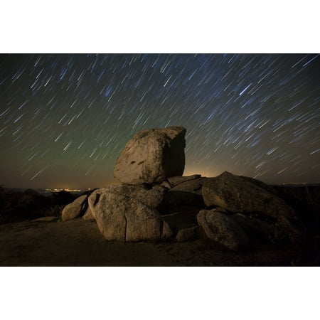 Star trails and large boulders in the high desert region of Anza Borrego Desert State Park California Poster