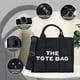 thumbnail image 3 of Fácil de combinar con toda la ropa de tu armario, el bolso de mano es una colección imprescindible para todos. El elegante bolso de mano de lona hace que sea fácil combinar con varias prenda, 3 of 5