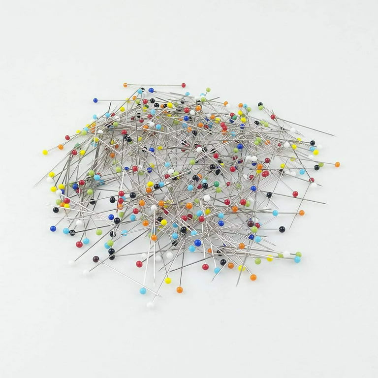 closeup-colourful-little-glass-tipped-sewing-pins-scattered-white