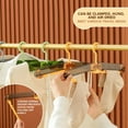 thumbnail image 4 of Percha de ropa plegable portátil - Organizador de viajes y hogar multiusos - Agarre a prueba de viento - Diseño que ahorra espacio - Plástico duradero - Ideal para ropa, accesorios, pañales - 1, 4 of 7
