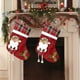 thumbnail image 1 of Set de Dos Artículos para Decoración Navideña: Calcetines Medianos con Diseño de Papá Noel, Muñeco de Nieve y Ciervo; Colgante para Árbol de Navidad y Bolsa de Dulces., 1 of 6