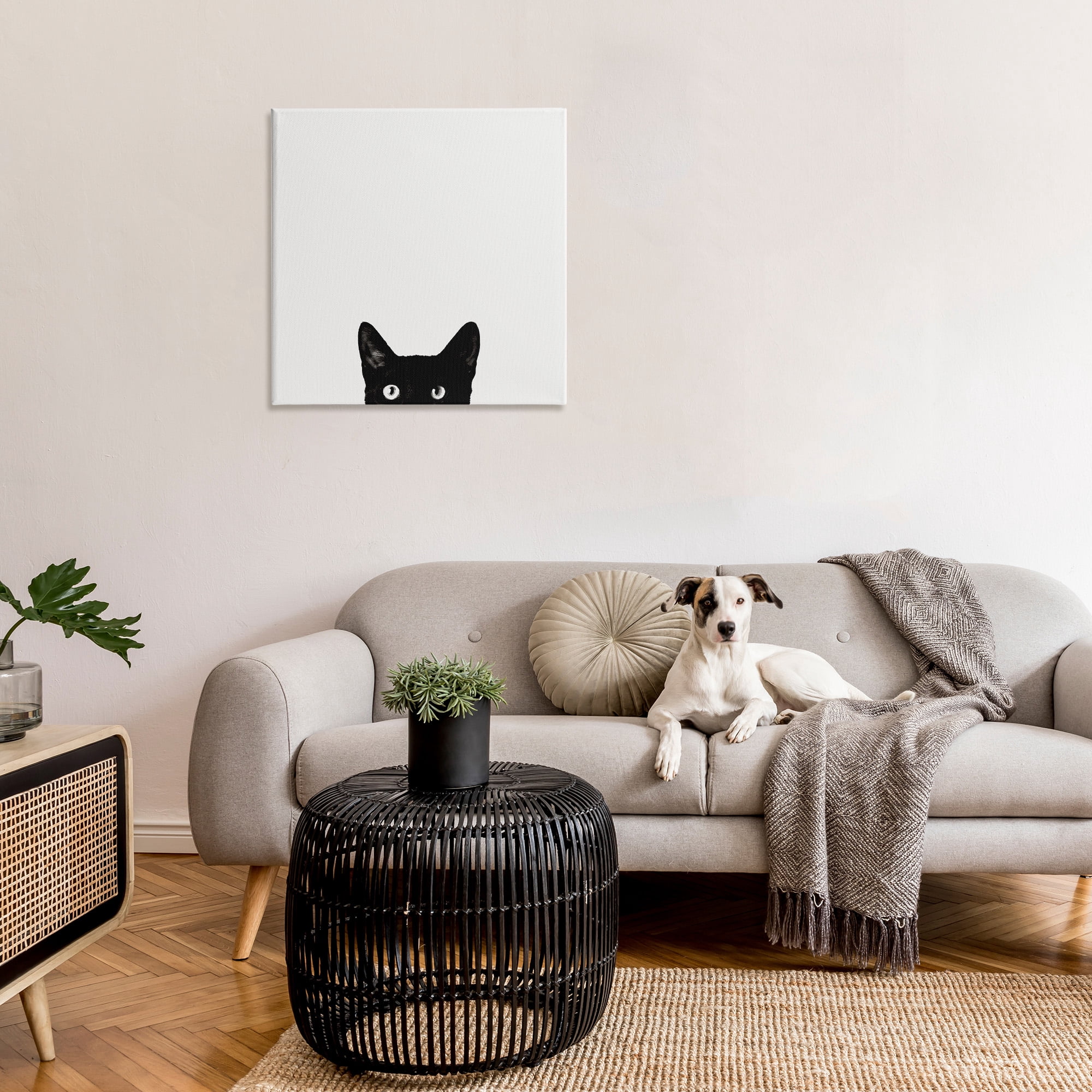 The Stupell Home Decor Minimal Monochrome Black Cat Peeking From Below Canvas Wall Art
