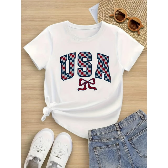 T-Shirt en Coton Patriotique pour Filles avec Drapeau Américain - Lettrage à Carreaux Rouge Blanc Bleu avec Nœud, Haut Décontracté à Manches Courtes et Col Rond Doux et Respirant pour le 4 Juillet, Tenue Décontractée pour les Fêtes