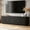Black, variant on HIUU 67" White Modern TV Stand ,Wooden Fluted TV Console Table with Sliding Doors for TVs up to 75",Floor Mount TV Stand for Living Room