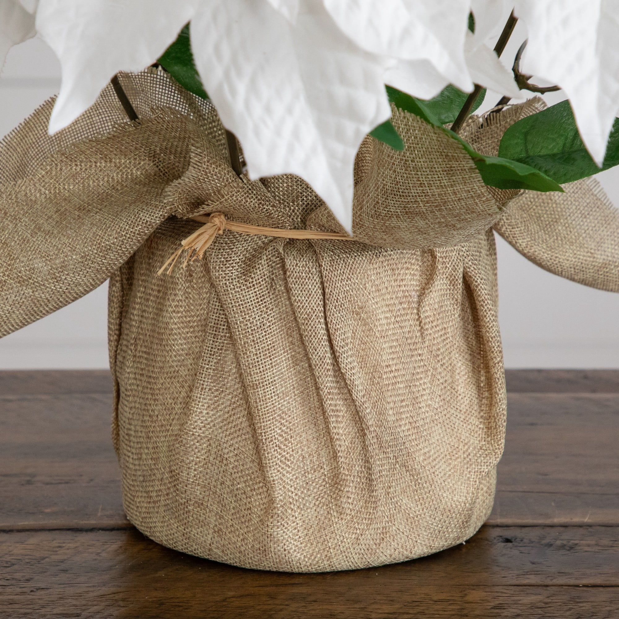 16in. Artificial Poinsettia Arrangement in Burlap Planter