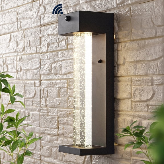 JONATHAN Y Miranda 5.13" 1-Light Modern Industrial Iron/Seeded Glass with Dusk-to-Dawn Sensor Integrated LED Outdoor Sconce, Black