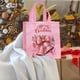 thumbnail image 4 of Seyotauo Christmas Pink Non-Woven Gift Bags with Festive Prints - Reusable Holiday Handbags for Gift Packaging, Santa / Reindeer / Bell Designs, Durable Tote Bags Ideal for Christmas Gifts,Home Decor, 4 of 6
