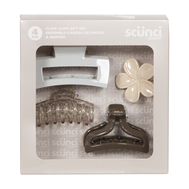 Scunci 4 piece neutral claw clip gift set with white rectangular clip, clear curved clip, brown triangular clip and beige flower-shaped clip in packaging.
