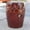 Brown, variant on Pemberly Row Tasseled Drum Ceramic Garden Stool in Navy Blue