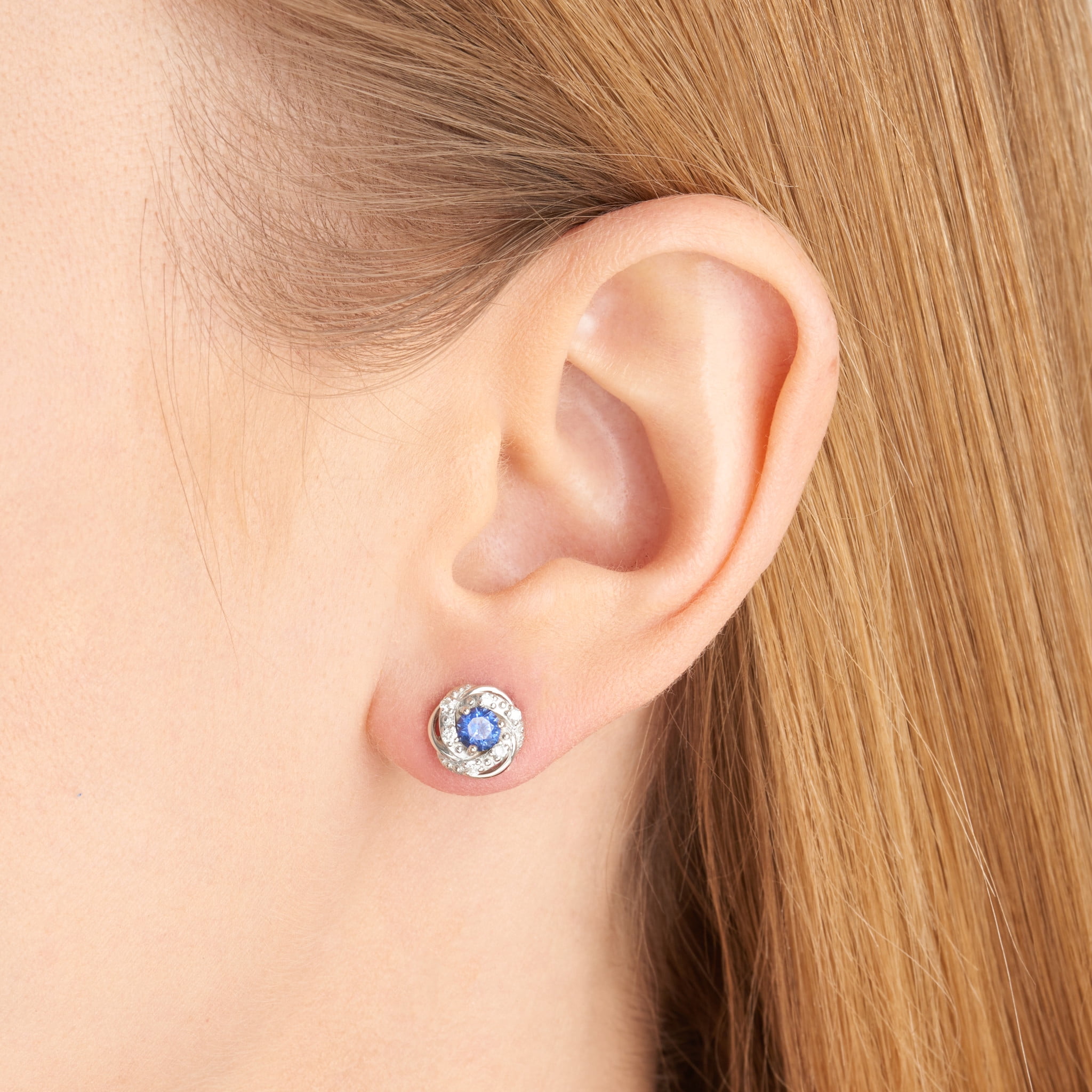 Forever Facets Jewelry Platinum Over Sterling Silver 1/8th Carat Total Weight Lab Grown Diamond and Created Blue Sapphire Delicate Knot Stud Earrings