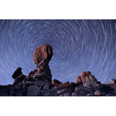 Star trails around the northern pole star Arches National Park Utah Poster Print by John DavisStocktrek