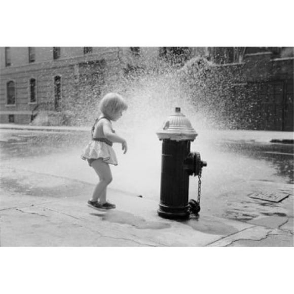 Posterazzi SAL255424646 Little Girl Cooling Off at Fire Hydrant on Street Poster Print - 18 x 24 in.