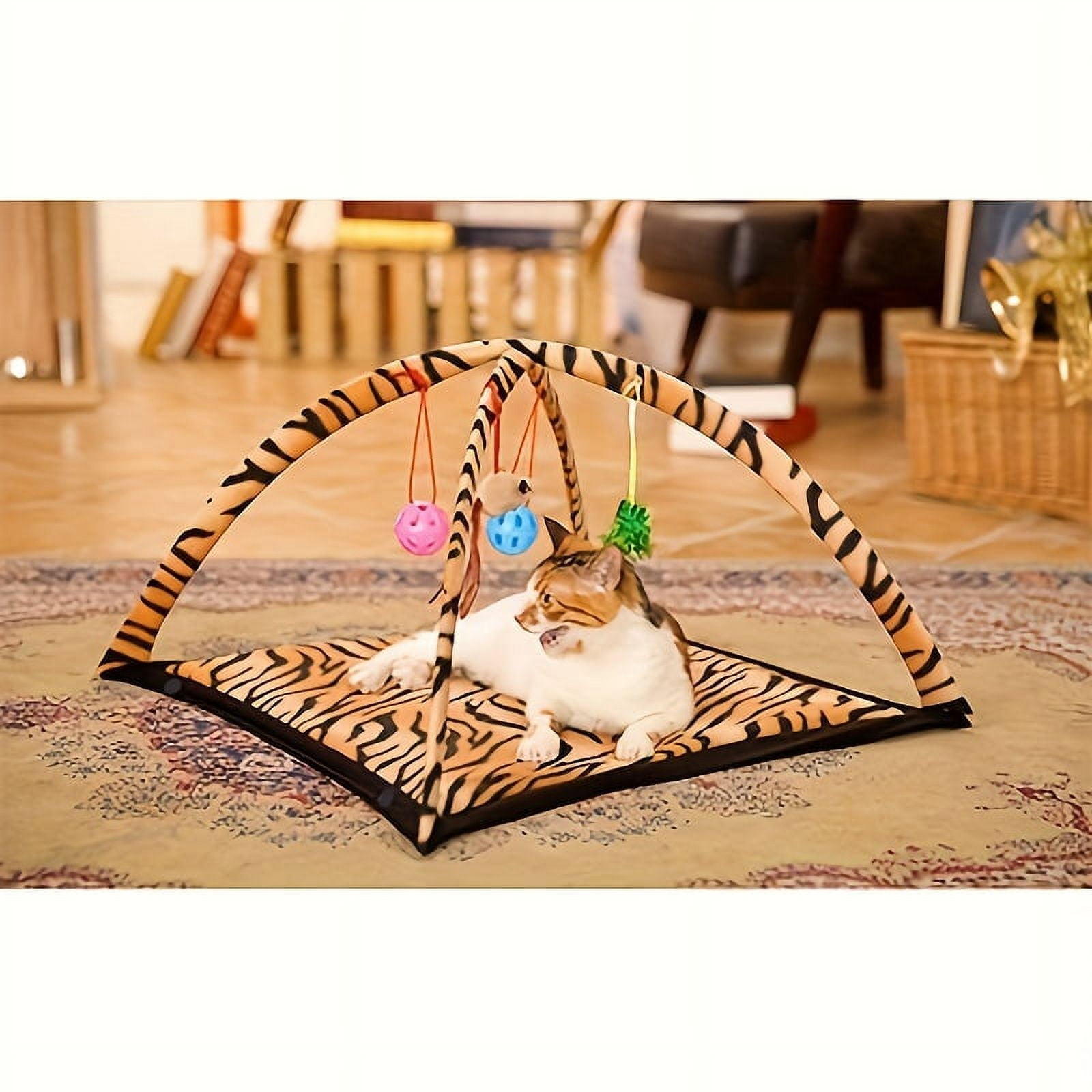 Interactive cat toy rocking activity mat for playing with cats, featuring a scratching area, hanging toys, and rolling balls