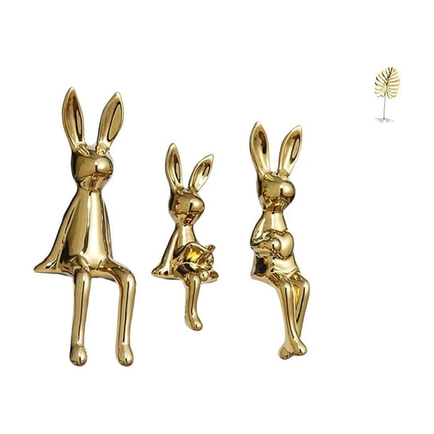 Figura decorativa abstracta de conejos con hojas metálicas, ideal como centro de mesa, estantería, escritorio o armario.