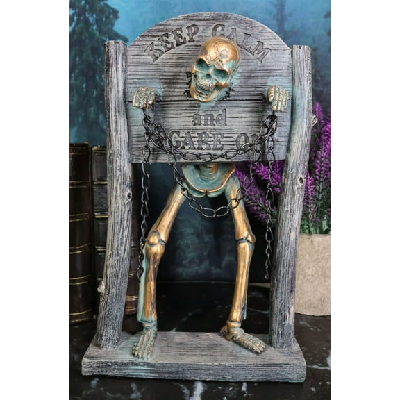 Grinning Skeleton Prisoner Chained At Pillory Keep Calm Scare On Sign Figurine