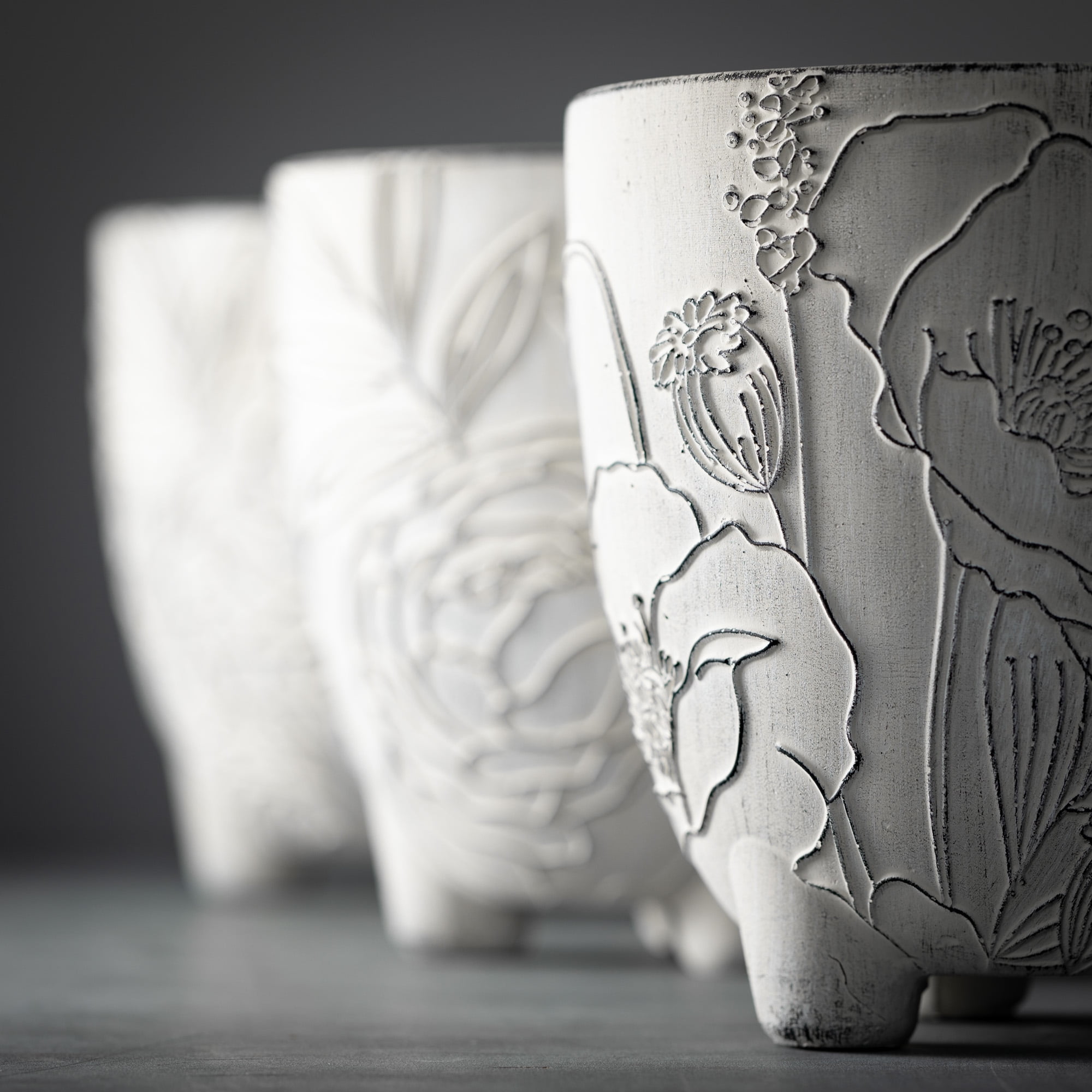 7.5"H Sullivans Large Cement Floral Line Art Pots Set of 3, Gray