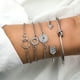 thumbnail image 2 of Pulsera con cadena de cinco piezas geométricas con abertura redonda y tachuelas, 2 of 6