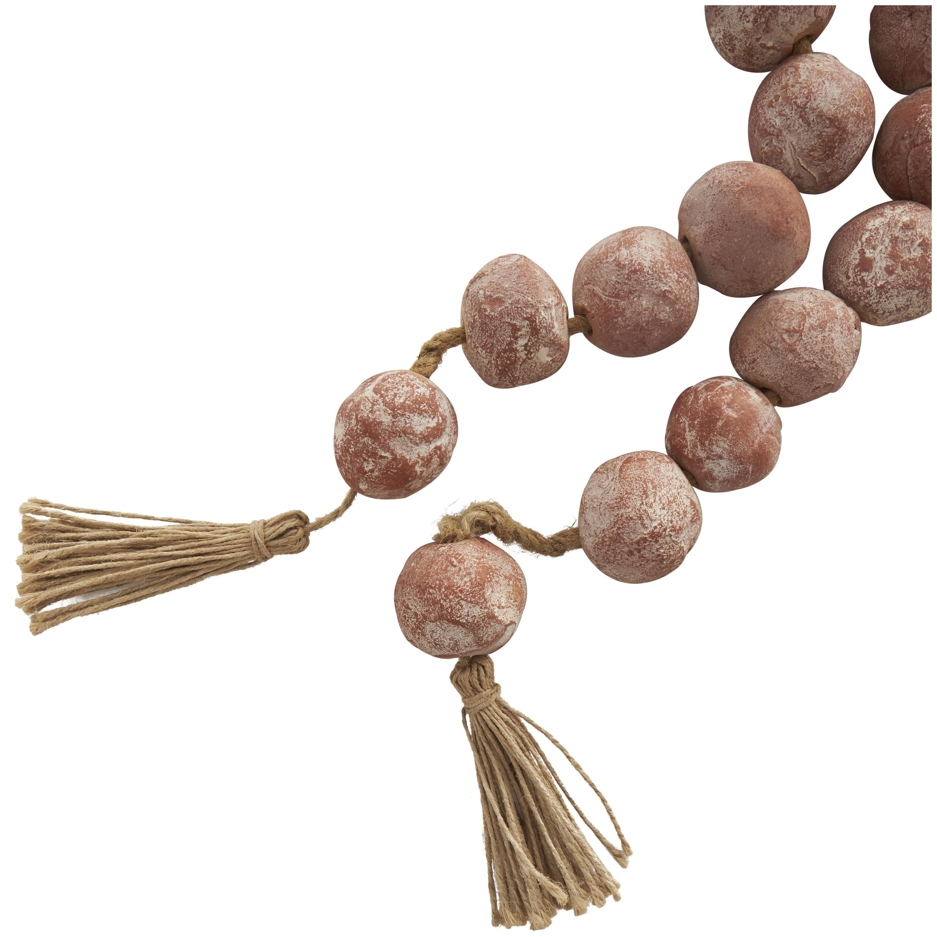 DecMode Handmade Round Intricately Shaped Large Distressed Orange Ceramic Garland with Tassel