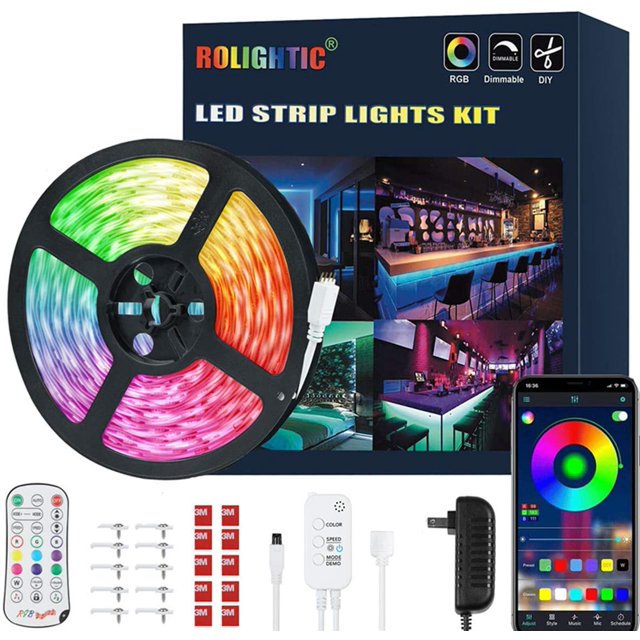 LED Strip Lights 32.8ft by RoLightic, featuring 300 RGB 5050 LEDs, displayed in a coiled reel with vibrant multicolour illumination. The kit includes a remote control, adhesive strips, hooks, screws, a power adapter, and a Bluetooth controller. The packaging highlights its smart app control, music sync, and dimmable features, suitable for bedroom ceilings or party ambiance.