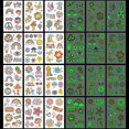 thumbnail image 1 of 12 hojas de tatuajes temporales navideños para niños, tatuajes temporales navideños que brillan en la oscuridad para niños, bolsas de regalo navideñas con decoraciones para fiestas de cumpleaños,, 1 of 5