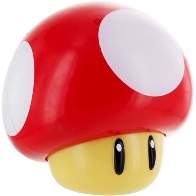 figura luminosa coleccionable con sonido de hongo toad de super mario bros de paladone, multicolor — figura luminosa con forma de hongo rojo con grandes lunares blancos y base amarilla con ojos ovalados negros; vista frontal centrada, plástico brillante; reproduce sonidos familiares de los juegos, ideal como coleccionable para sala de juegos o dormitorio y suele usarse también como luz nocturna de escritorio.