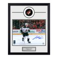 thumbnail image 1 of Logan Cooley Autographed Arizona Coyotes Puck Logo 19x23 Frame, 1 of 2