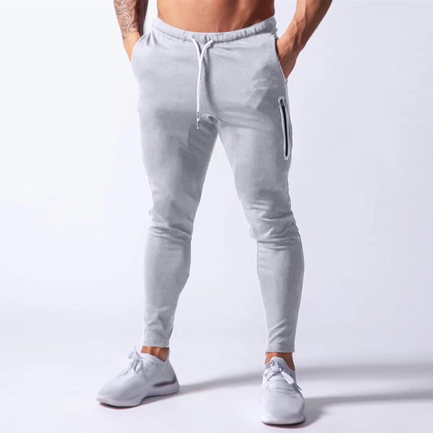 Pantalones deportivos de moda para hombre, con cordón ajustable, ajustados, elásticos, con cremallera invisible, elásticos, de poliéster y algodón.