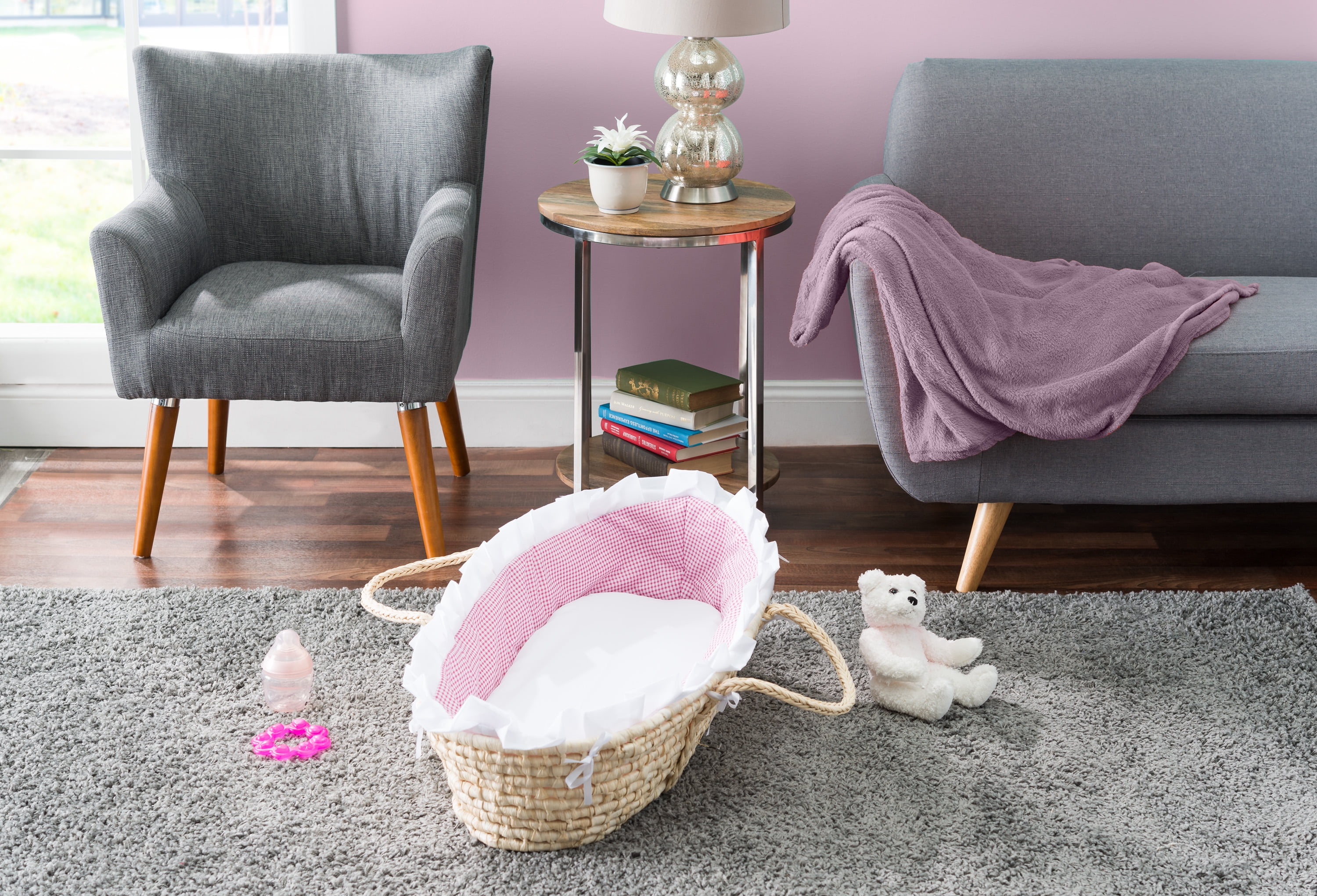 pink moses basket with drapes