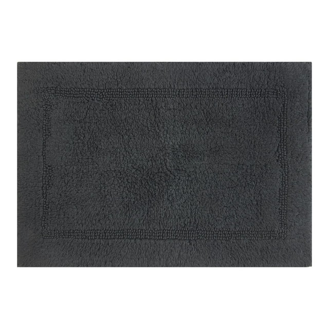 Soft grey reversible cotton bath rug with a subtle textured rectangular border, sized 17 by 24 inches.